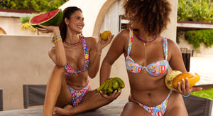 2 women wearing Bydee Australian designed bikinis in Salsa and Cabana print